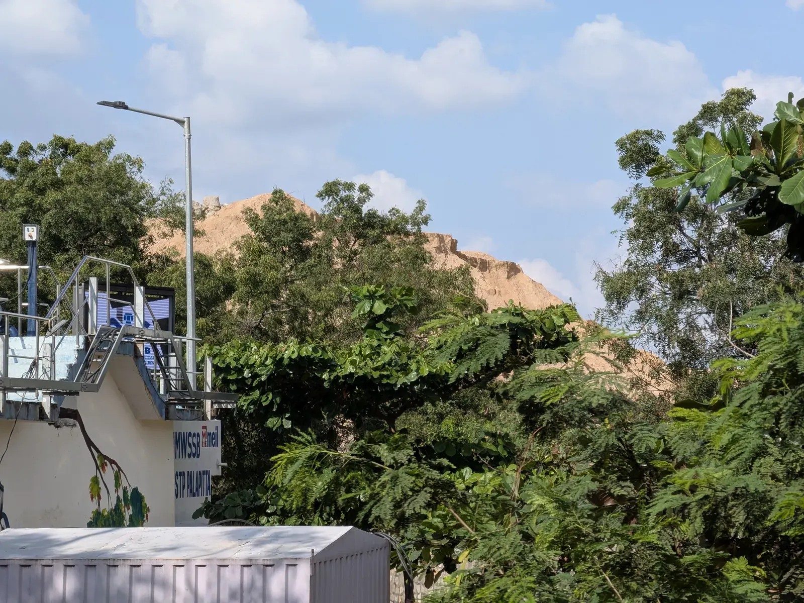 A graphic showing a water tap with a drop icon, overlaid with a map of Hyderabad, symbolizing water supply information.