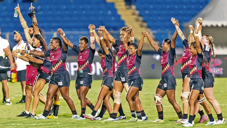 Delhi Redz women's rugby team celebrating victory at Gachibowli Stadium