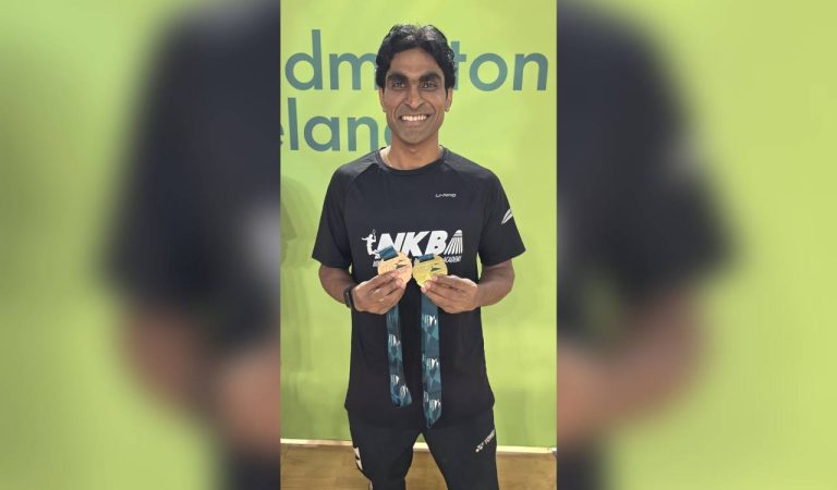 Tokyo Paralympic gold medallist Krishna Nagar on a badminton court with medals
