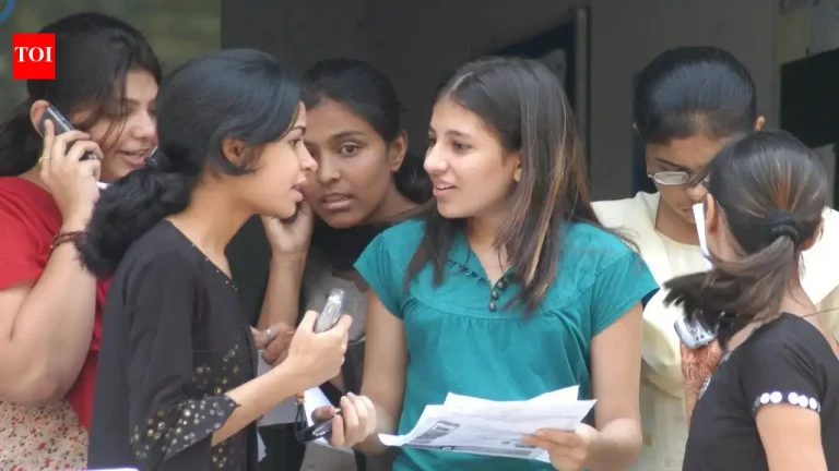 Worried students looking at an official notice board outside a junior college in Hyderabad