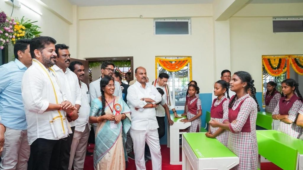 Chief Minister A. Revanth Reddy speaking with students during a school inauguration in Telangana.