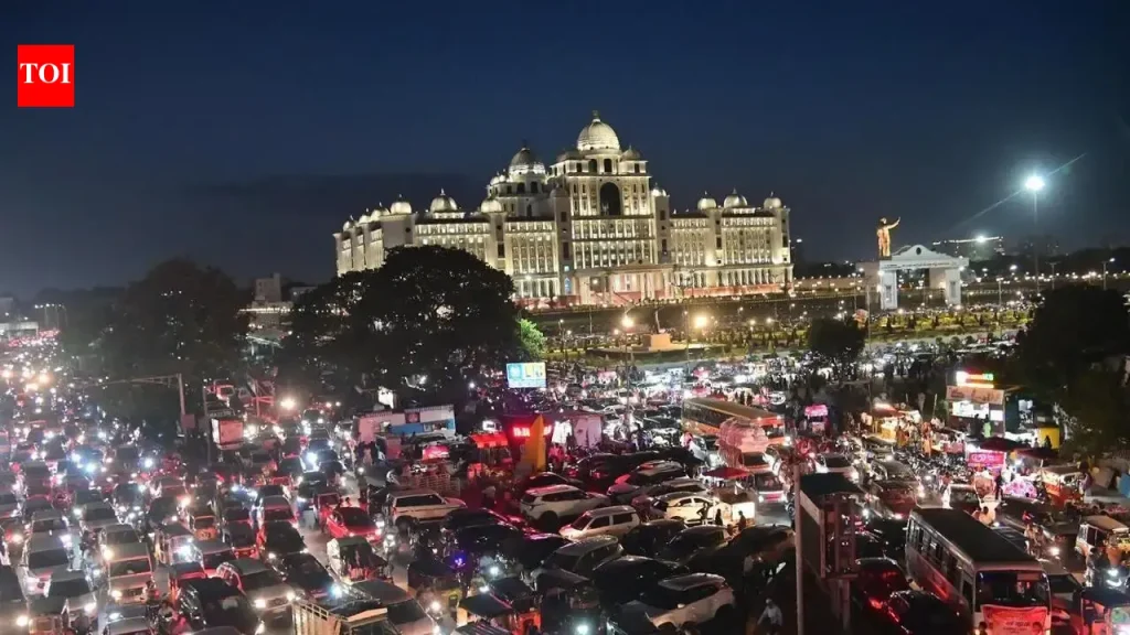Traffic jam on Necklace Road in Hyderabad with vehicles stopped in both directions