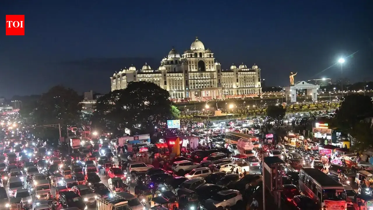 Traffic jam on Necklace Road in Hyderabad with vehicles stopped in both directions