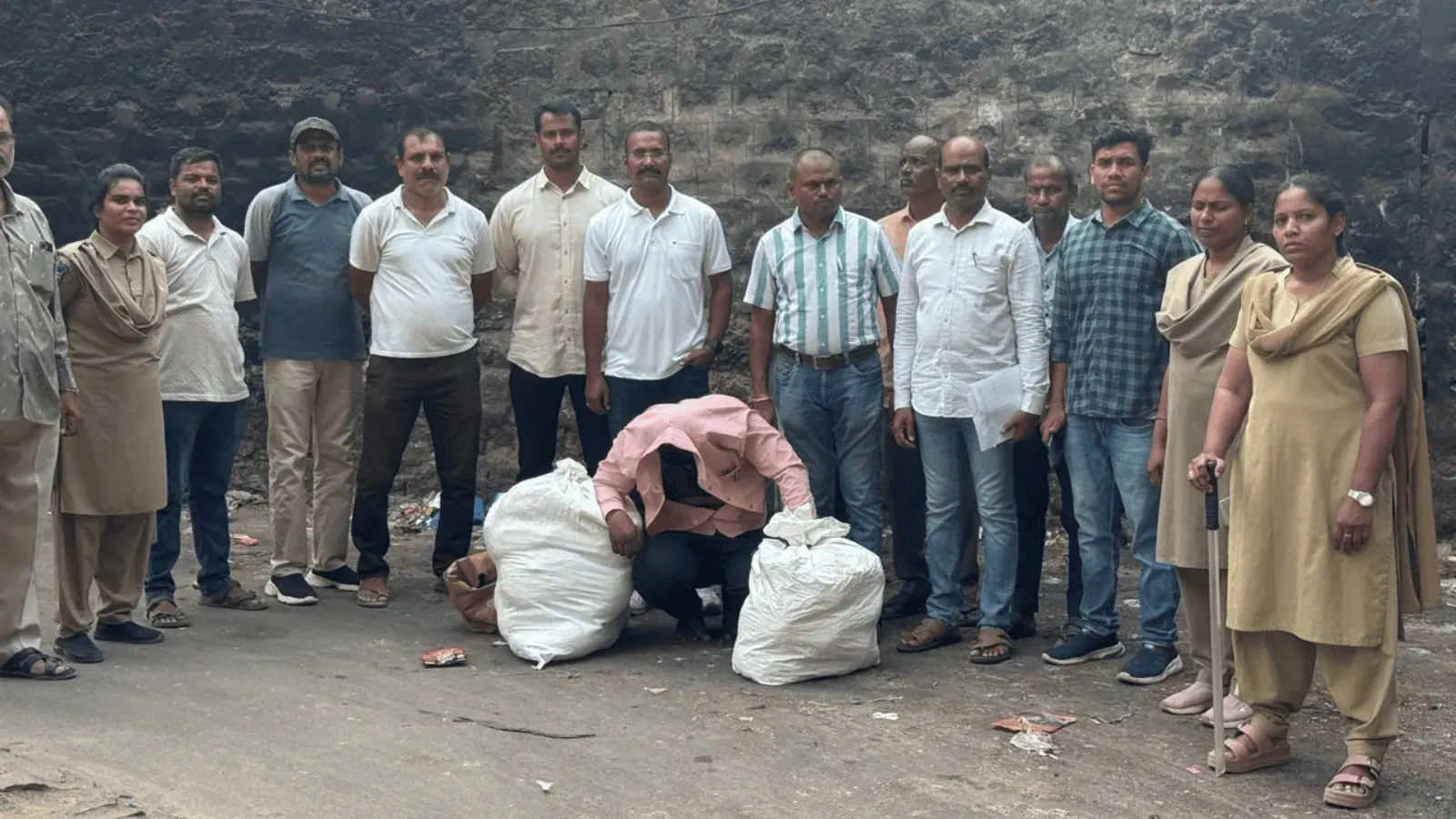 Dhoolpet police officers with seized ganja packets and a scooter used for drug transportation in Hyderabad